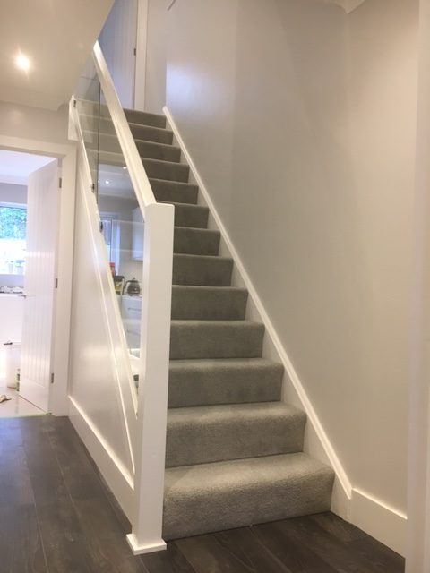 Full staircase view with glass balustrading